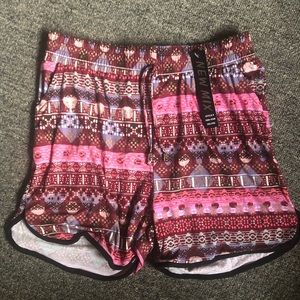NWT Pink pattern dolphin shorts pockets